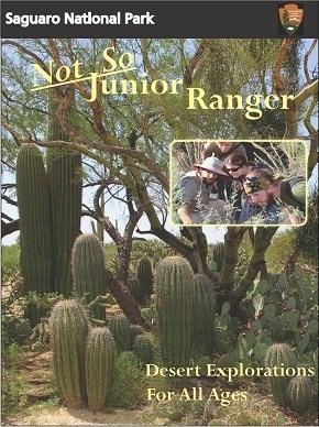 Image of booklet with many young saguaros, inset photo of people looking at a plant, and text reading "Not So Junior Ranger.  Desert Explorations For All Ages"