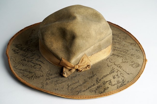 Brown felt hat signed by reporters traveling with Theodore Roosevelt on his 1900 campaign.