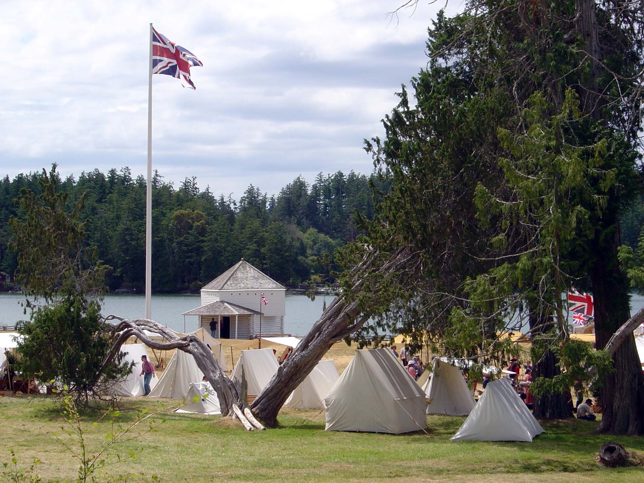 a full group of tents in front of a british flag