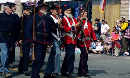 Park staff and volunteers form the 1860's Color Guard in the island's Fourth of July parade.