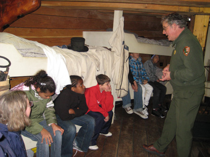 a school group learning about sailor's lives in the fo'c'sle of Friendship
