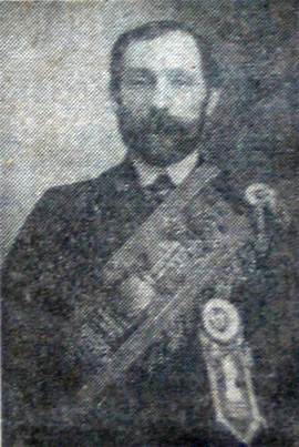 Portrait of a bearded man in late-19th century club regaila