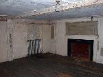 view of paneled wall and fireplace