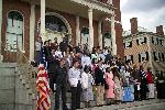A group of people on the steps of the Custom House