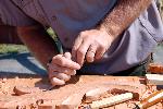 using a chisel to carve a leaf