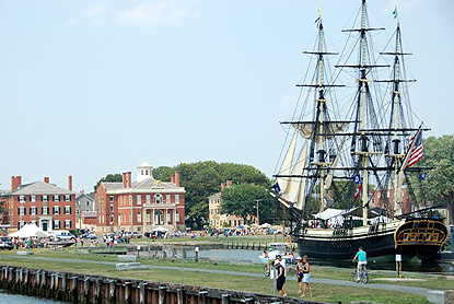 a view of the Salem Maritime Festival, with the tall ship Friendship in the foreground, and tents in the background