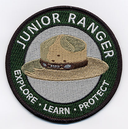 a junior ranger patch, with the NPS hat on it.