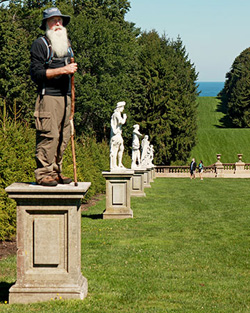 a hiker standing on the pedestal of a missing statue