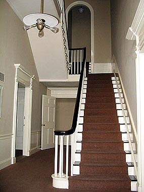 the graceful entry hall of the U.S. Custom House in Salem features a long flight of stairs to the second floor.
