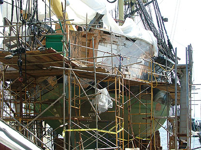 removing damaged wood from the bow of Friendship