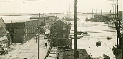 Historic photo showing the buildings and activities on Derby Wharf, c. 1900.