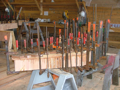 dozens of clamps are used to make sure the laminated knees dry correctly
