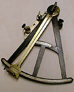 An ebony, ivory and brass sextant used for navigation.