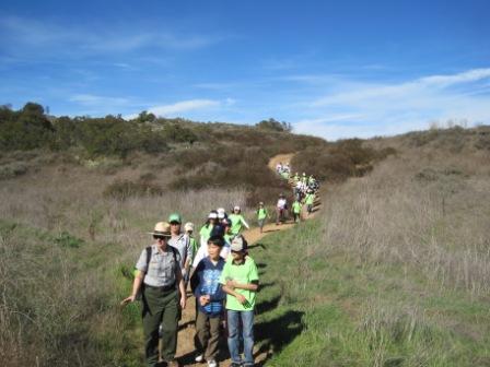 Ranger Mary leads a group of students on a hike to explore the park.