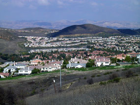 Urban encroachment in the Simi hills, California from residential developments leads habitat fragmentation and loss of habitat for native wildlife. Urban encroachment in the Simi hills, California from residential developments leads habitat fragmentation and loss of habitat for native wildlife.