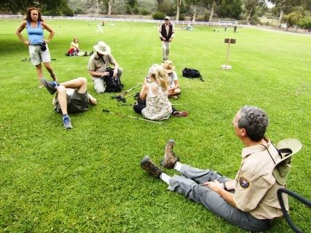 BBT hikers relax on the lawn at Will Rodgers State Historic Park.