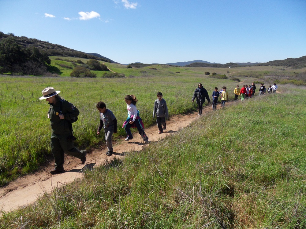 Park ranger leads school children on hike