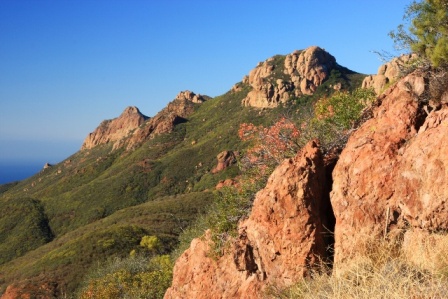 Hikers can view the colorful cliffs that make up Circle X Ranch from the Backbone Trail.