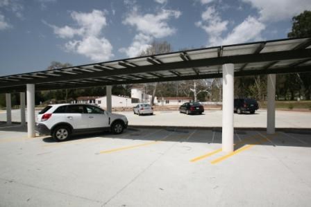 Solar panels in the parking lot help keep cars cool.