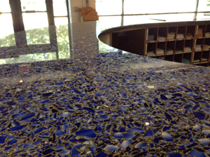 This visitor center desk is not only wonderful to look at it, it's made of recycled materials.