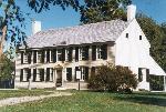 Large yellow historic Colonial house