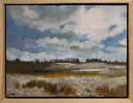 Brown fields and wooded area
