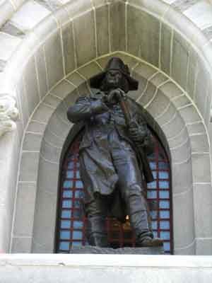 Life-sized bronze statue of American General Horatio Gates.  He holds a small telescope and looks into the distance.