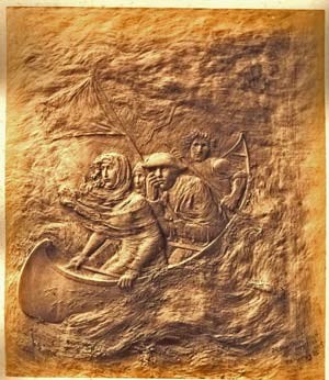 Bronze plaque portraying Lady Harriet Ackland and a few others on a small boat, headed under a flag of truce toward American positions.