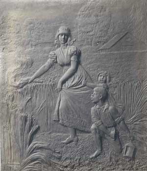 Bronze plaque portraying Catherine Schuyler setting fire to the wheat fields at her family's country estate.