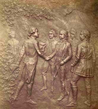 Bronze plaque portraying British General John Burgoyne surrendering to American General Horatio Gates.