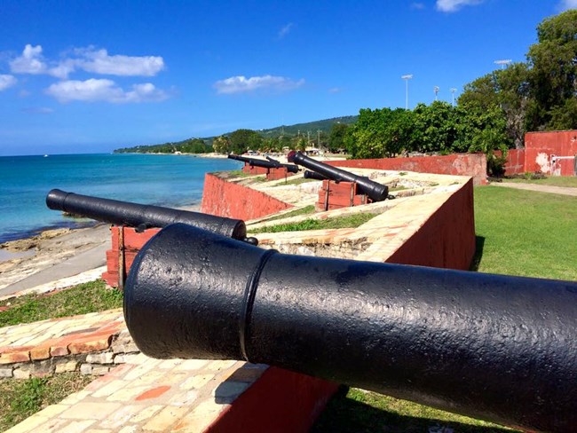 cannons at fort pointing out to Caribbean Sea
