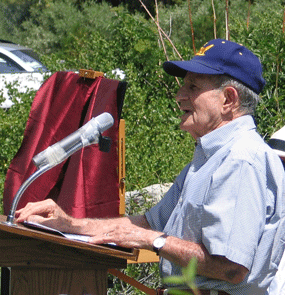 Profile of former congressman Krebs at the podium