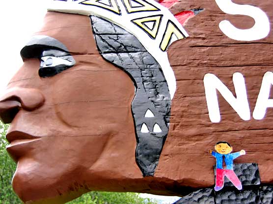 Historic Sequoia Indian head sign with cartoon of little man