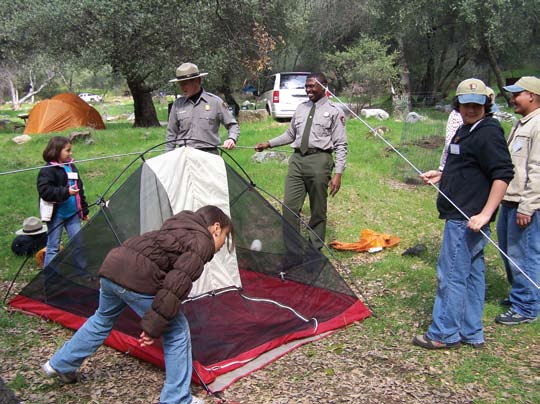 CAMP participants set up a tent