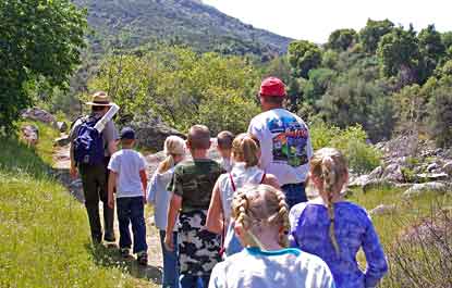 Ranger leads park visitors in a hike in the foothills area of the park.