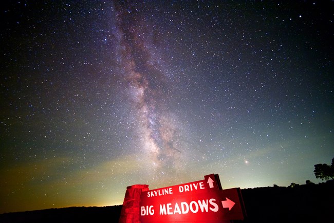 The Milky Way Galaxy shines over the Skyline Drive sign at Big Meadows.
