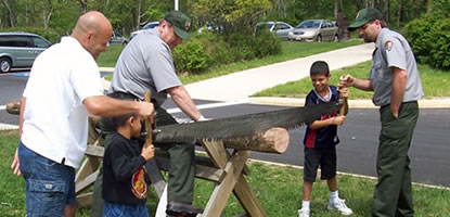Visitors saw a log using a traditional two-man saw during Shenandoah's annual Wilderness Weekend.
