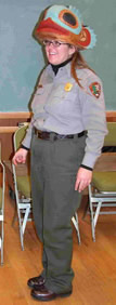 A park ranger wearing a wooden helmet.