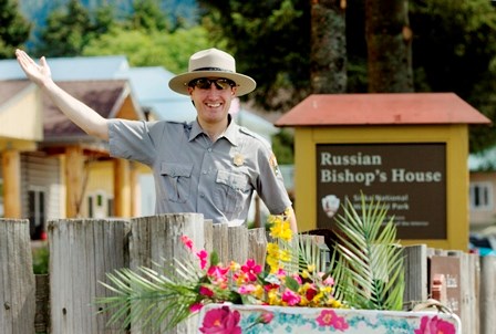 Ranger waving at the camera from in front of Russian Bishop's House