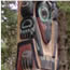  A close up view of a totem pole.  Southeast Alaska totem poles line the trails within the park.