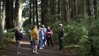 A ranger and several visitors on the Totem Trail