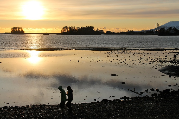 walking at sunset at the visitor center beach