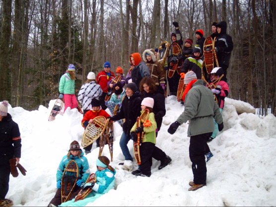 Children enjoy a Park Ranger-led snowshoe hike at a Sleeping Bear Dunes National Lakeshore FUN event.  Photo courtesy of the National Park Service.