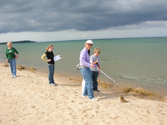 Park volunteers clean up their adopted beach in the National Lakeshore. Photo courtesy of National Park Service.