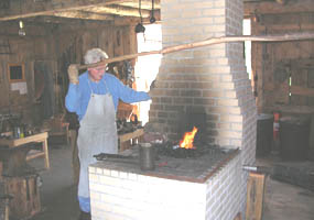 Blacksmith working at the forge
