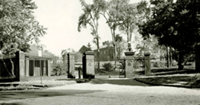 Historic Byers Street Gate entrance with guard on duty, ca. 1930.