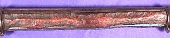 A close-up of the chewed-up Enfield forestock
