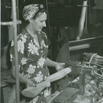 A Woman Ordnance Worker makes a gun stock at Springfield Armory during World War II