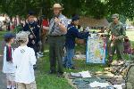 Park Ranger Richard Colton speaks to visitors about weapons of the Korean War at Armory Day, 2008