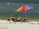 Sunbathers watch the surf at Gulf Islands National Seashore. Photo: Warren Bielenberg